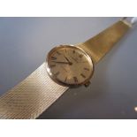 Ladies 18ct gold Omega De Ville wristwatch with integral woven 18ct gold bracelet, the gilt dial