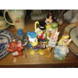 Group of nine Walt Disney Production ceramic figures