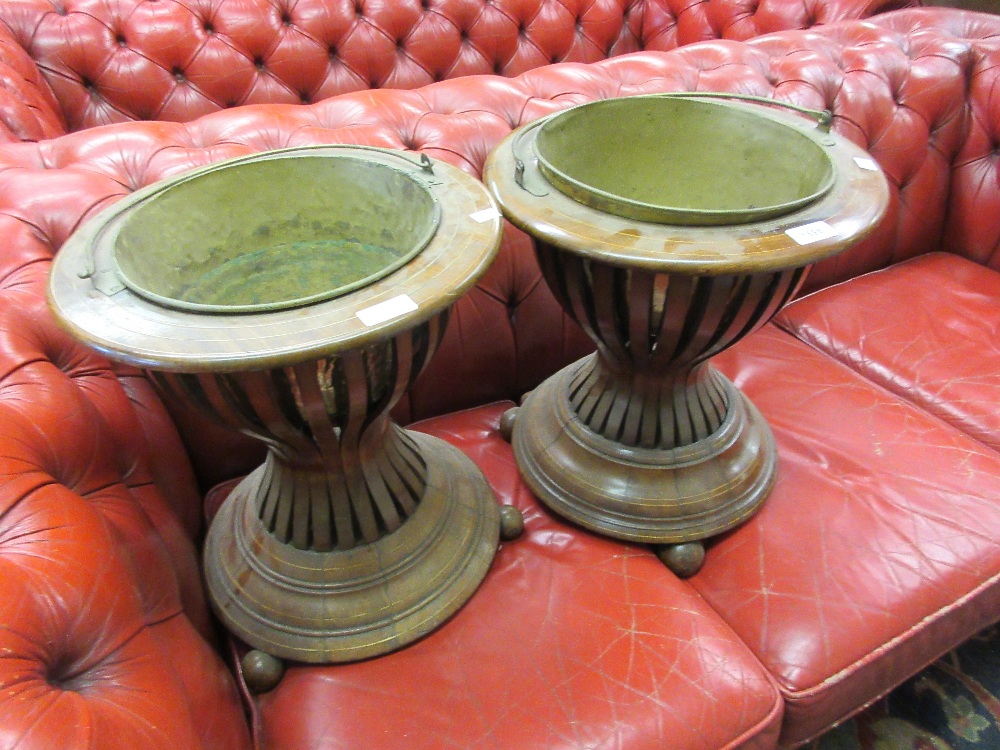 Matched pair of 19th Century walnut and line inlaid jardinieres, the circular tops with brass