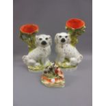 Pair of Staffordshire flat back spill vases in the form of seated spaniels together with another
