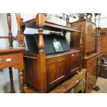 Victorian mahogany buffet with two panel doors raised on low turned feet