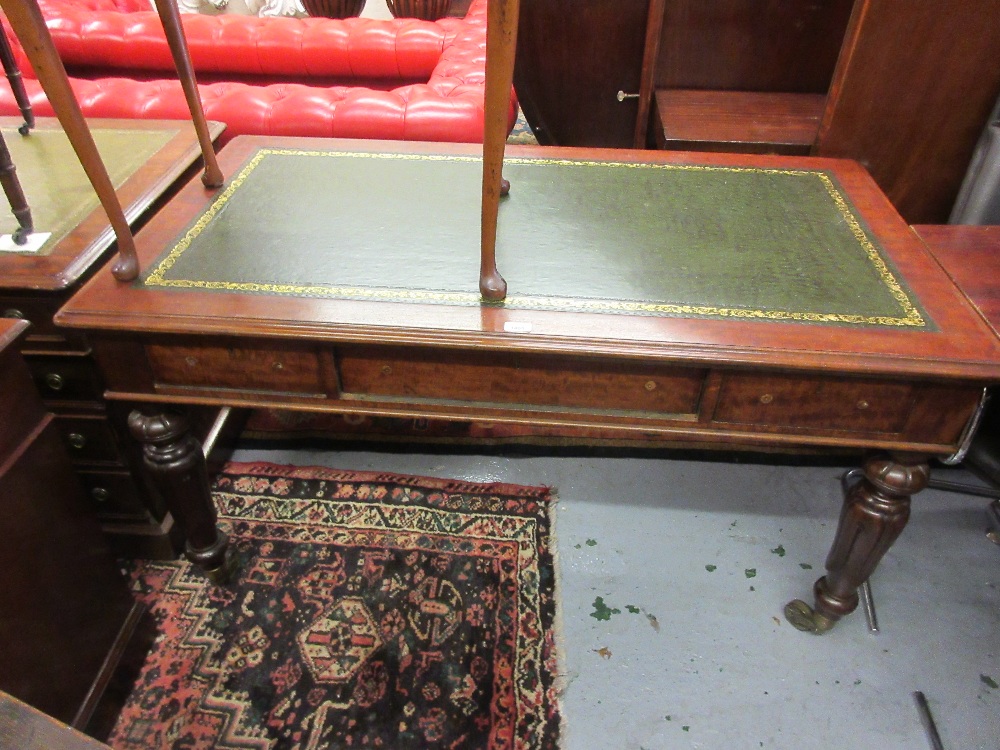 Victorian mahogany library table, the green tooled leather inset top above three frieze drawers