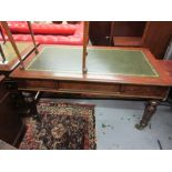 Victorian mahogany library table, the green tooled leather inset top above three frieze drawers