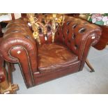 Brown buttoned leather upholstered Chesterfield armchair