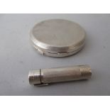 Circular silver compact together with a silver lipstick holder