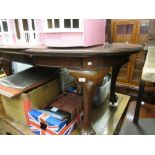 Small early 20th Century oval mahogany wind-out extending dining table with single extra leaf,