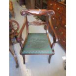 Regency mahogany carved rail back open elbow chair, the drop-in seat raised on sabre front supports