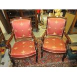 Pair of French Empire mahogany open armchairs with acanthus leaf carved arms and cabriole supports