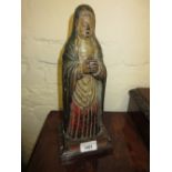 16th / 17th Century or earlier, carved oak and polychrome figure of a female saint, standing with