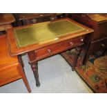 Victorian mahogany writing table with a green tooled leather inset top above a frieze drawer