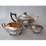 Sheffield silver three piece tea service, the teapot with ebony finial and handle
