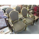 Set of four French style gilt open armchairs with padded backs, overstuffed seats and cabriole front