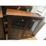 Late 19th Century walnut bookcase with two glazed doors enclosing adjustable shelves