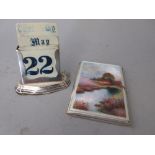 Rectangular London silver cigarette case, the cover enamel decorated with a landscape (at fault),