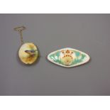 Two small Royal Worcester porcelain plaques in 9ct gold brooch mounts, one signed The larger has had