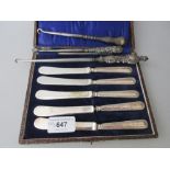 Cased set of six silver handled dessert knives, three silver handled crochet hooks and a large