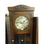 1930's Oak longcase clock, the circular silvered dial with Arabic numerals and three train weight