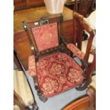 Victorian ebonised and gilded floral upholstered drawing room armchair on turned fluted tapering