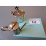 Two Tiffany and Co. silver condiments in the form of a watering can and water pail