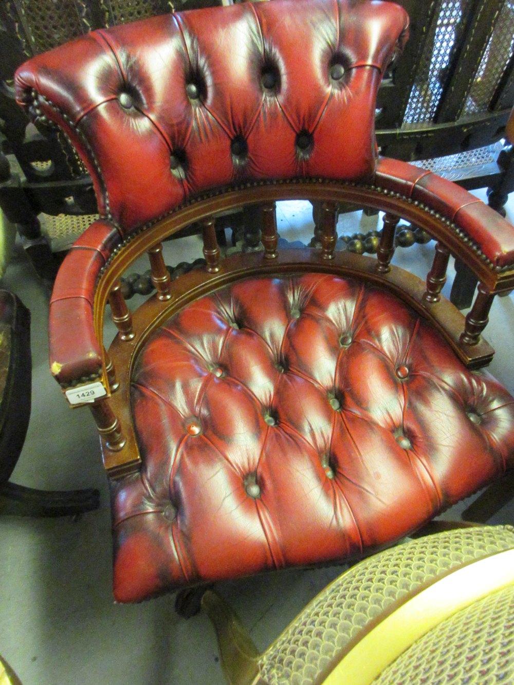 20th Century red leather button upholstered swivel office chair (slight damage to the leather)