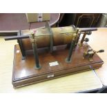 Ashton and Holt, late 19th Century induction coil having lacquered brass fittings on a mahogany