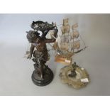 Patinated spelter cherub figure together with three filigree models of ships, a butter dish and a