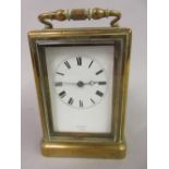 Late 19th Century French enraved brass cased carriage clock, the enamel dial with Roman numerals,