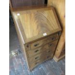 Reproduction mahogany bureau with a fall front above three drawers