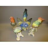 Naples porcelain figure of a parakeet together with three other large figures of birds All dirty,