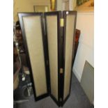 Pair of modern ebonised simulated leather covered folding three panel screens