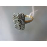 Art Deco rectangular panel ring of pierced design, set three central diamonds surrounded by