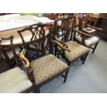 Near pair of 19th Century mahogany Chippendale style open armchairs with drop-in seats raised on