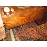 19th Century figured mahogany sofa table having opposing end drawers, one fitted with writing