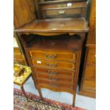 Art Nouveau mahogany crossbanded and inlaid music cabinet, the tray top above five serpentine