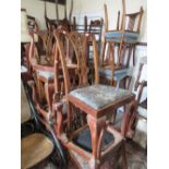 Set of eight mahogany Chippendale style dining chairs, the carved splat backs having floral