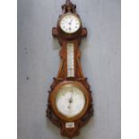 Late 19th / early 20th Century carved walnut cased three glass thermometer / barometer / clock,