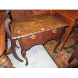 18th Century oak lowboy, the plank top having crossbanded edge and star inlay to centre above two