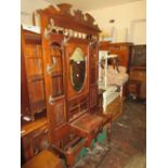 Large 19th Century mahogany hall stand having various hooks, glove drawer and twin stick stands (one
