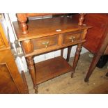 20th Century oak two drawer side table having brass drop handles with ring turned supports and