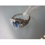 18ct White gold oval sapphire, brilliant and baguette cut diamond set ring
