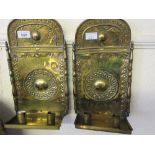 Pair of late 17th Century brass twin light wall sconces, decorated with repousse work and dated AN