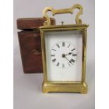 Large brass cased carriage clock, the enamel dial with Roman numerals and two train movement