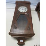 Early 20th Century Continental oak cased rectangular wall clock with carved decoration of roses, the