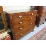 Large late George III mahogany straight front chest of two short and three long drawers with oval