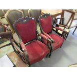 Pair of 19th Century French mahogany and upholstered open elbow chairs with scroll arms raised on