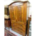 19th Century flame mahogany linen press having arched moulded cornice above two panelled doors