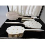 Cased silver gilt and enamel three piece dressing table set together with another silver mounted
