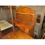 Small Victorian mahogany serpentine fronted chiffonier with a shelf back and two panelled doors,