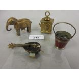 Four 19th Century tape measures in the forms of an elephant, coal bucket, mandolin and carriage