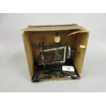 Child's early 20th Century German sewing machine in original box